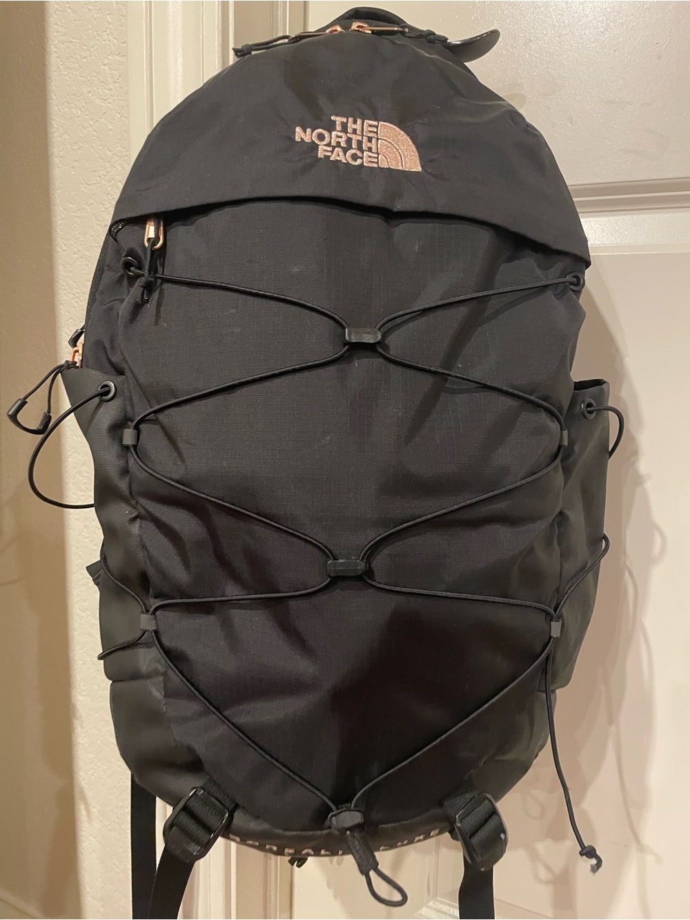 The North Face Black Backpack with Rose Gold Logo and Zipper